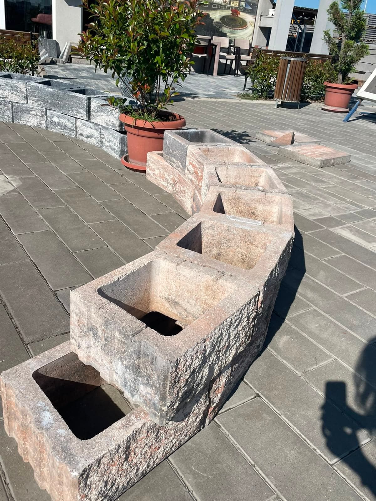 Decorative blocks in Color Mix brown-white, laid in a run on concrete paving at the Globi MI yard
