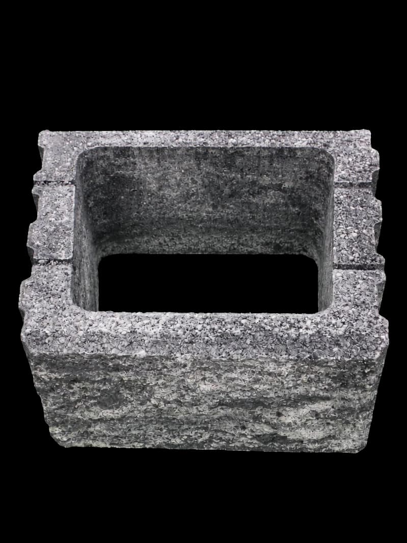 Globi MI decorative concrete block in Color Mix black-white, with an open core and a split face