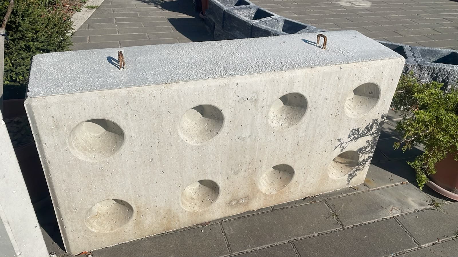 Globi MI concrete block showing eight sockets on the broad face and a screeded narrow face, at the plant yard