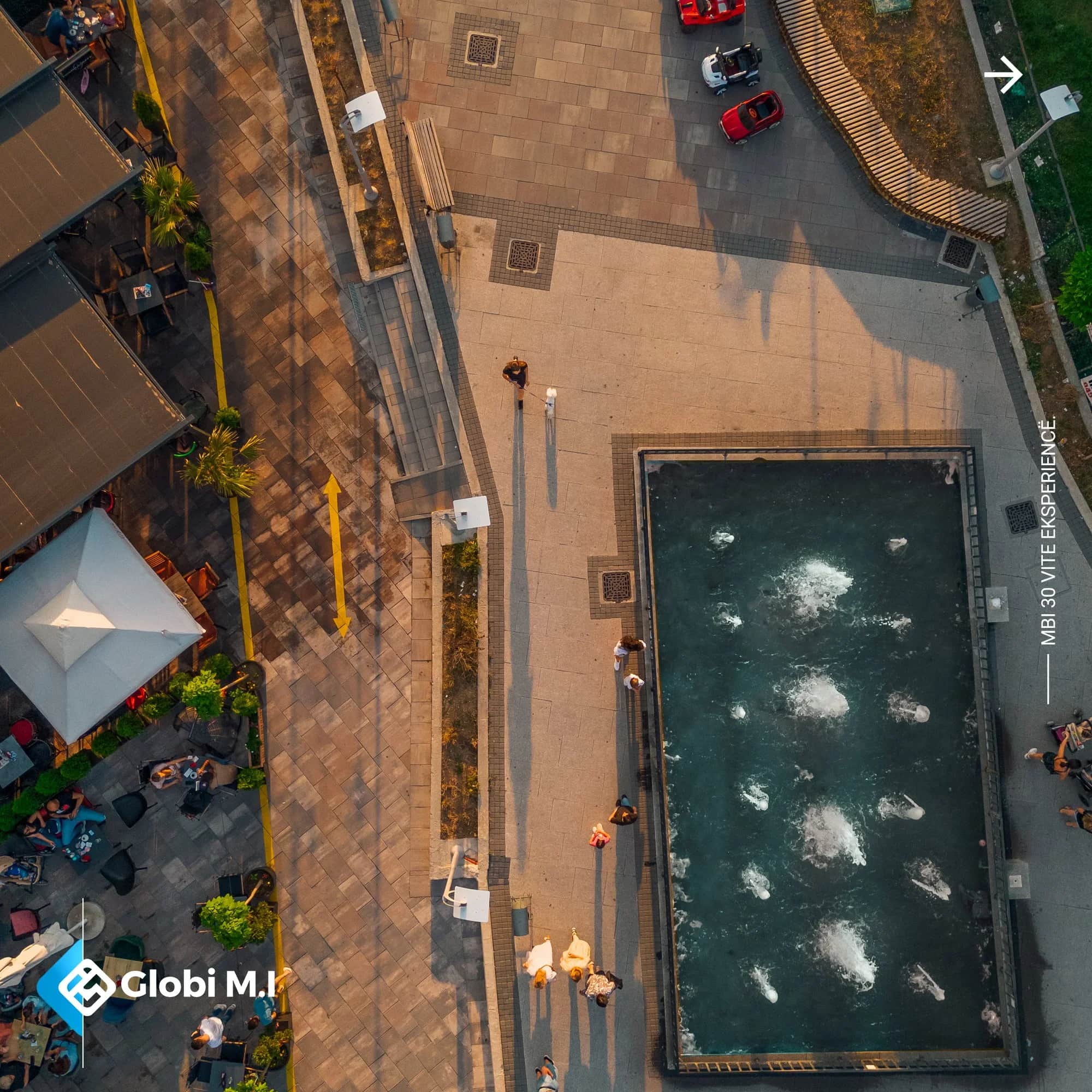 Paved surface around a water basin on the square in Gjilan.